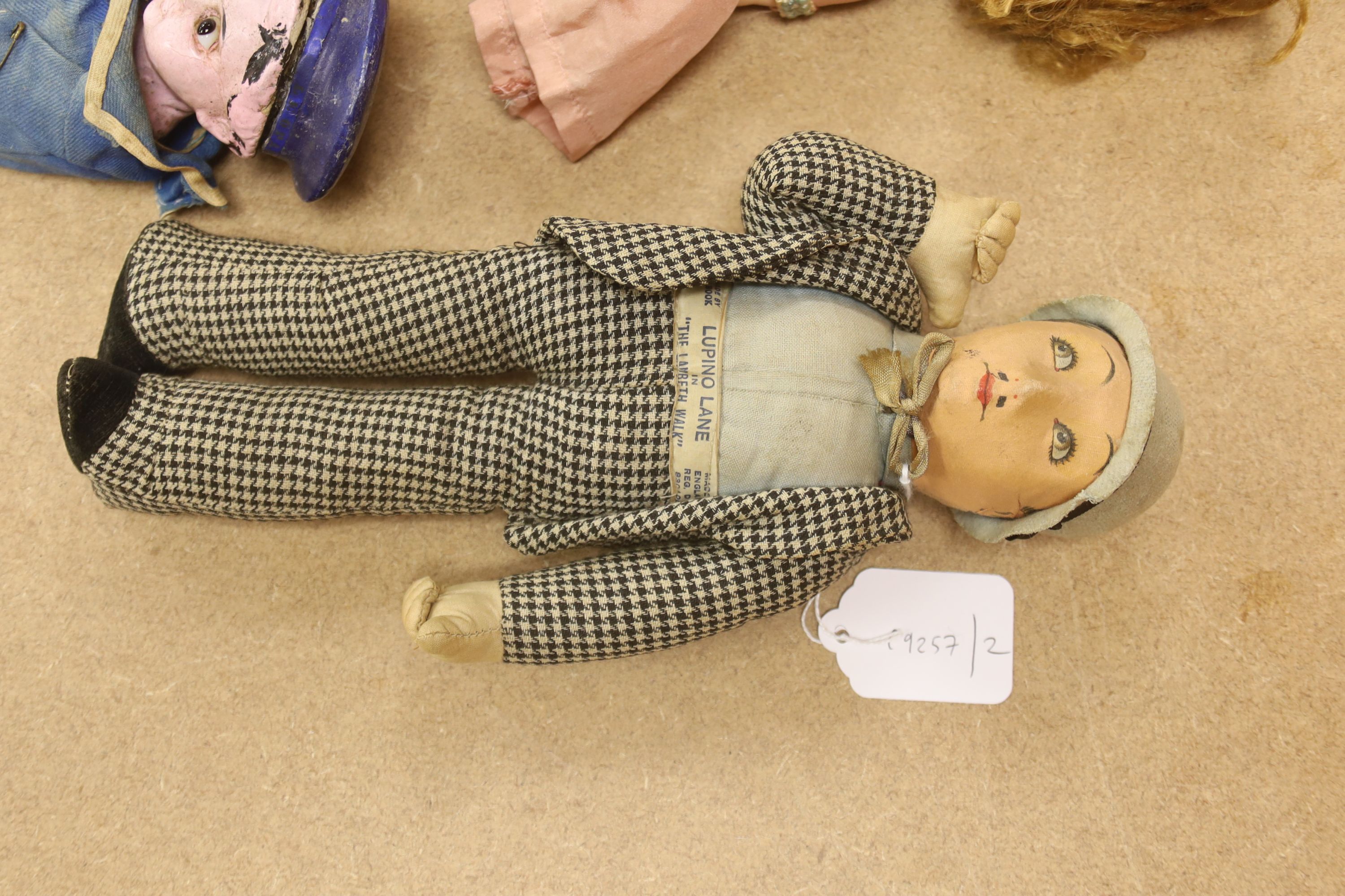 A Deans rag book 'Lupino Lane The Lambeth Walk', a doll wax sailor doll, pedigree and three others